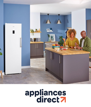 Appliances Direct - Couple chatting in a kitchen diner beside a Beko Fridge