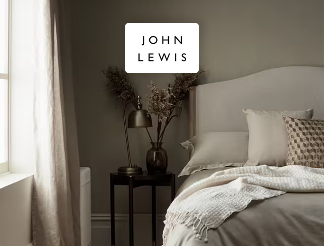 John Lewis & Partners - Bedroom space with neutral toned bedding and decor