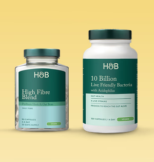 Product image of supplements, a smaller bottle of "High Fibre Blend" on the left and a "10 Billion Live Friendly Bacteria capsules" bottle on the right