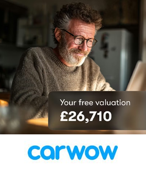 Carwow - Man on laptop looking at a free car valuation