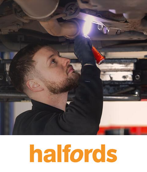 Halfords - MOT repairs being carried out on underside of car