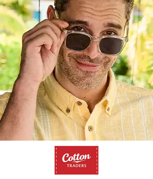 Cotton Traders - Man wearing a yellow linen shirt and sunglasses