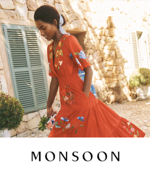 Monsoon - Woman wearing long flowing red dress with floral print