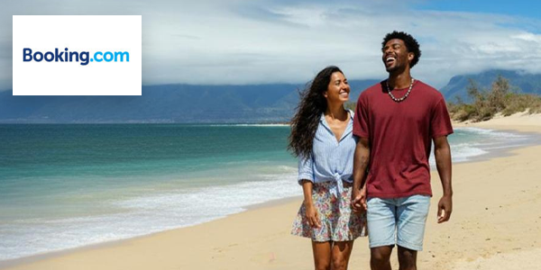 Booking.com - Couple walking on the beach