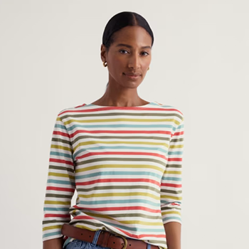 Seasalt - A person wearing a colorful striped shirt with 3/4 sleeves stands confidently against a plain background.