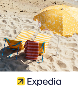 Expedia - Yellow striped sun loungers on a beach