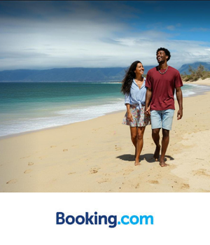 Booking.com - Couple walking across the beach holding hands