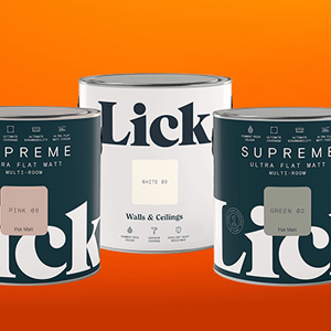 Three paint cans against an orange background.