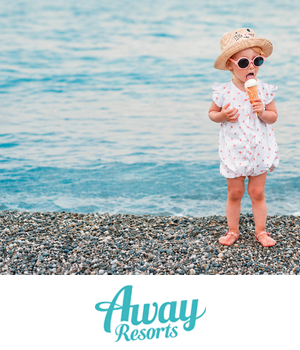 Away Resorts - A toddler in a sun hat and pink sunglasses eats an ice cream