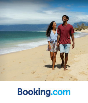 Booking.com - Couple walking along the beach