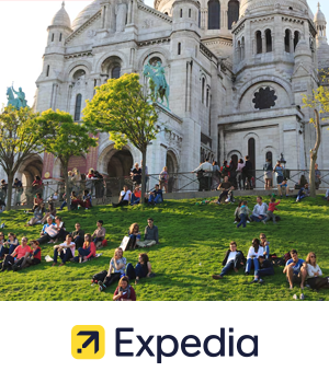 Expedia - People relax in front of the Sacré-Cœur Basilica in Paris