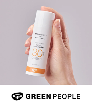 Green People - Bottle of Green People SPF being held up