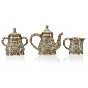 A Three-Piece Russian Pan-Slavic Cloisonné Enameled Gilt Silver Tea Service Fabergé, Attributed to Feodor Rückert, Moscow... (Total: 3 )