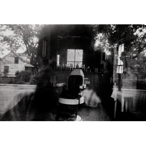 Robert Frank (American, 1924-2019) Barber Shop Through the Screen Door, McClellanville, S.C., 1955