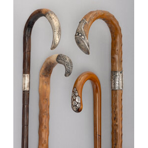 Four Silver-Mounted, Carved Wood, and Bamboo Canes, circa 1899 and later Marks to one: 925/1000, FINE