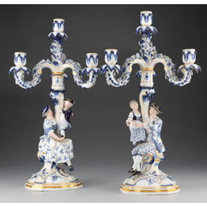 A Pair of Meissen Blue Onion Pattern Porcelain Figural Candlesticks with Four-Light Candelabrum, 1855-1863 Marks: (crossed swords in blue underglaze), (various)