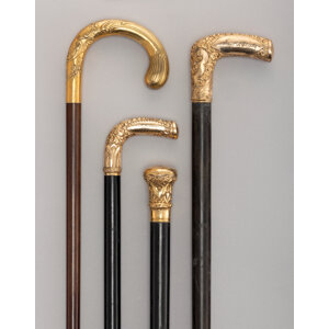 Four 10K, 14K, 18K Gold, Gilt, and Carved Wood Canes, circa 1900 37 x 1-1/2 inches (94.0 x 3.8 cm) (tallest)