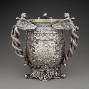 A Tiffany & Co. Chased Repoussé Partial Gilt Silver Three-Handle Presentation Cup, New York, 1898 Marks: TIFFANY & CO., 1