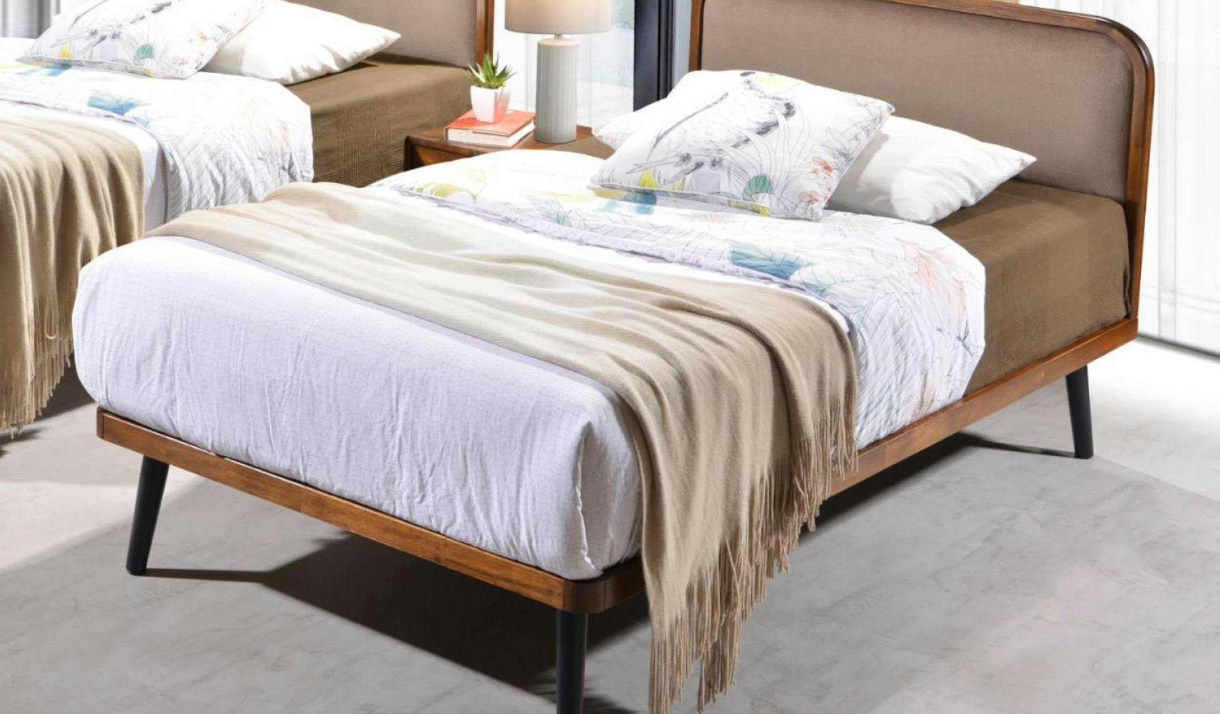 Black slip-on shoes with white soles made of leather, ideal for a casual style.