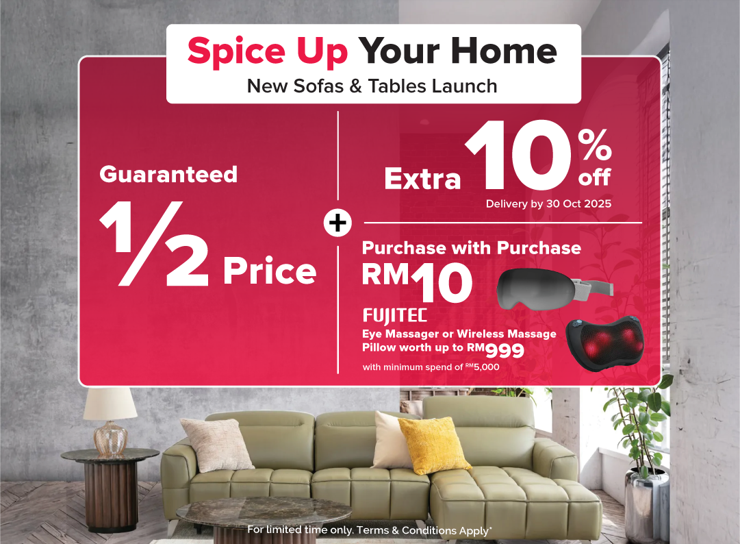 Woman wearing an olive green blazer and light blue jeans walking in an urban setting.