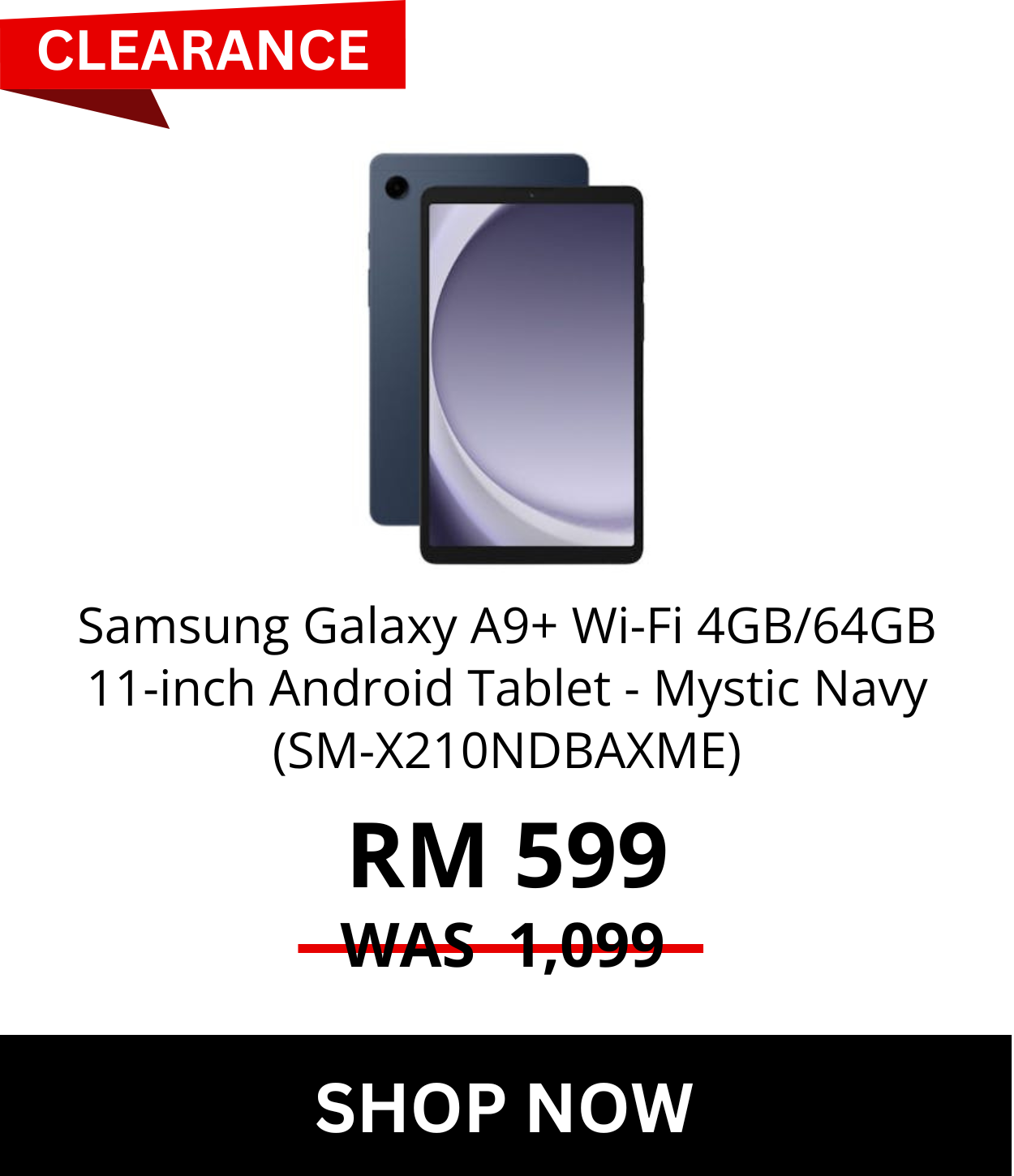 Man in a gray blazer over a dark gray shirt standing on stairs in an urban background.