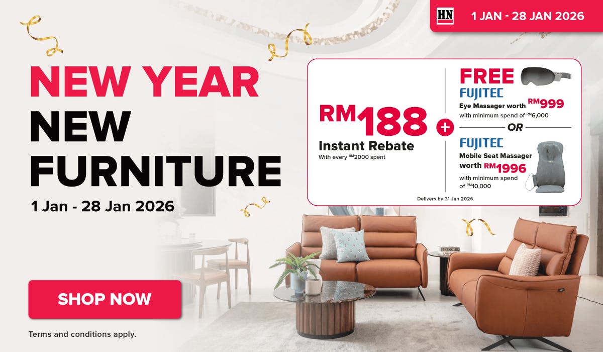 Woman wearing an olive green blazer and light blue jeans walking in an urban setting.