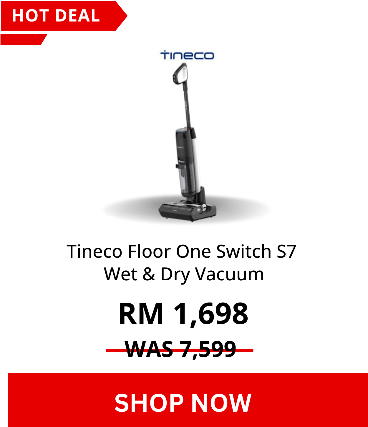 Woman wearing an olive green blazer and light blue jeans walking in an urban setting.