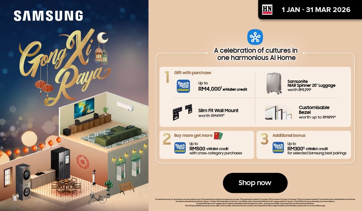 Woman wearing an olive green blazer and light blue jeans walking in an urban setting.