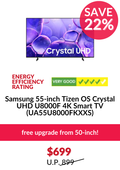 Man in a gray blazer over a dark gray shirt standing on stairs in an urban background.