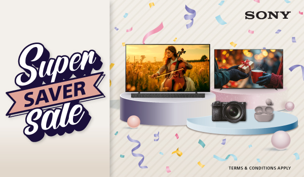 Three women enjoying a shopping day, carrying multiple colorful shopping bags while walking together outdoors.