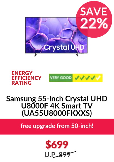 Man in a gray blazer over a dark gray shirt standing on stairs in an urban background.