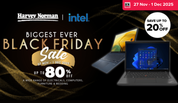 Woman wearing an olive green blazer and light blue jeans walking in an urban setting.