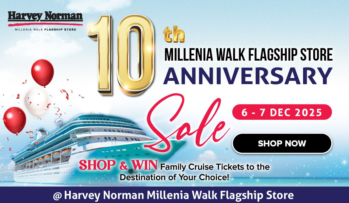 Three women enjoying a shopping day, carrying multiple colorful shopping bags while walking together outdoors.