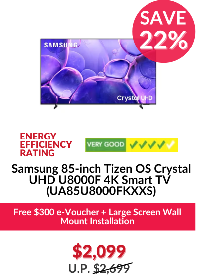 Man in a gray blazer over a dark gray shirt standing on stairs in an urban background.