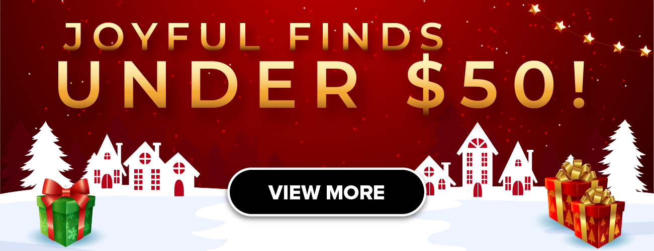 Man in a gray blazer over a dark gray shirt standing on stairs in an urban background.