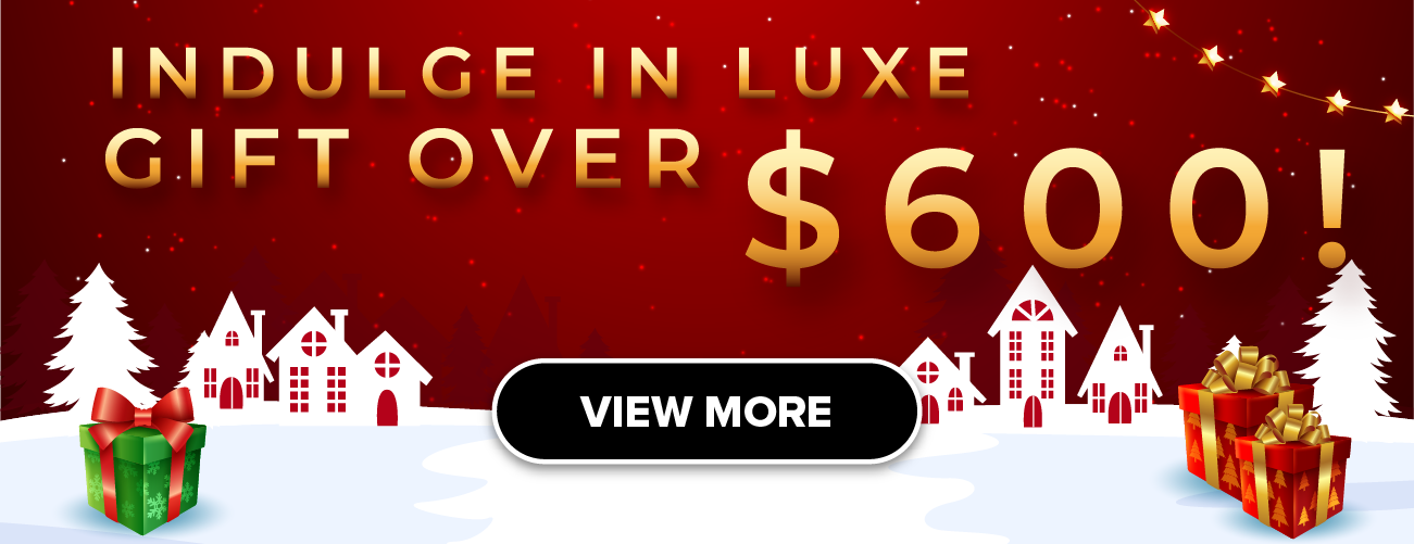 Woman wearing an olive green blazer and light blue jeans walking in an urban setting.