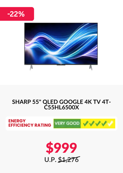 Man in a gray blazer over a dark gray shirt standing on stairs in an urban background.