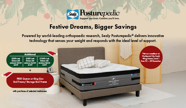 Woman wearing an olive green blazer and light blue jeans walking in an urban setting.