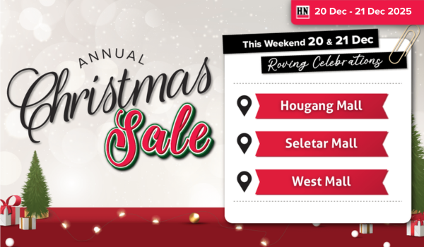 Woman wearing an olive green blazer and light blue jeans walking in an urban setting.