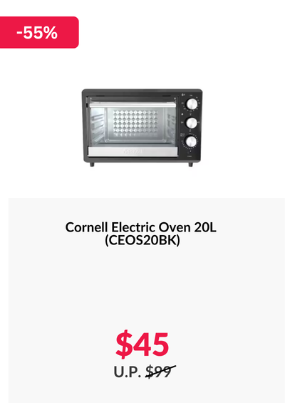 Woman wearing an olive green blazer and light blue jeans walking in an urban setting.