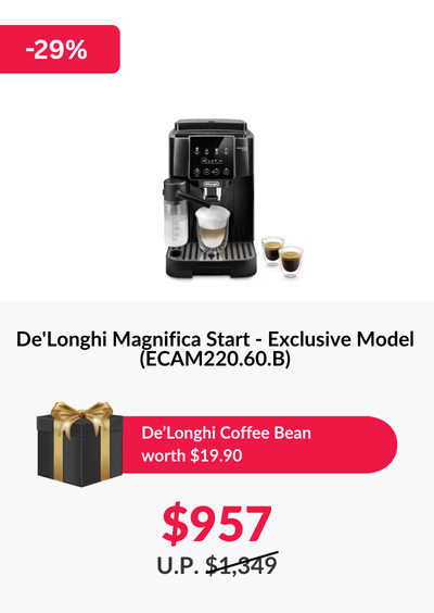 Man in a gray blazer over a dark gray shirt standing on stairs in an urban background.