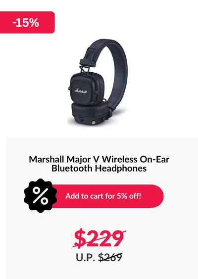 Woman wearing an olive green blazer and light blue jeans walking in an urban setting.