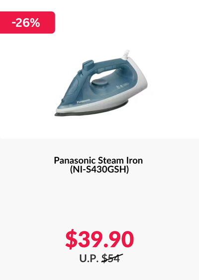 Man in a gray blazer over a dark gray shirt standing on stairs in an urban background.