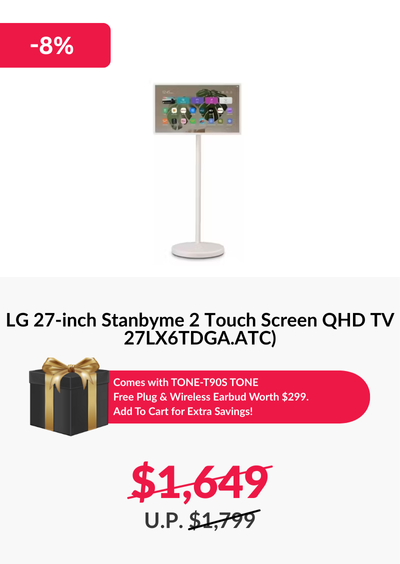 Man in a gray blazer over a dark gray shirt standing on stairs in an urban background.