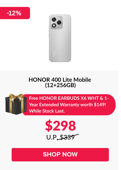 Man in a gray blazer over a dark gray shirt standing on stairs in an urban background.