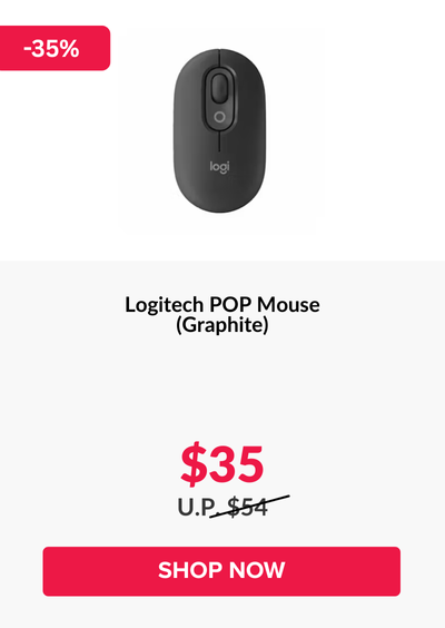 Woman wearing an olive green blazer and light blue jeans walking in an urban setting.