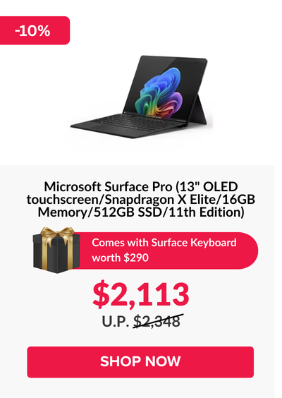 Man in a gray blazer over a dark gray shirt standing on stairs in an urban background.