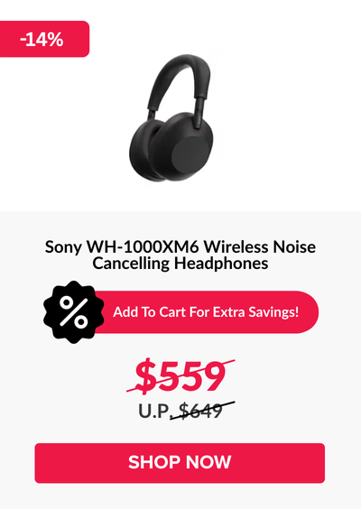 Woman wearing an olive green blazer and light blue jeans walking in an urban setting.