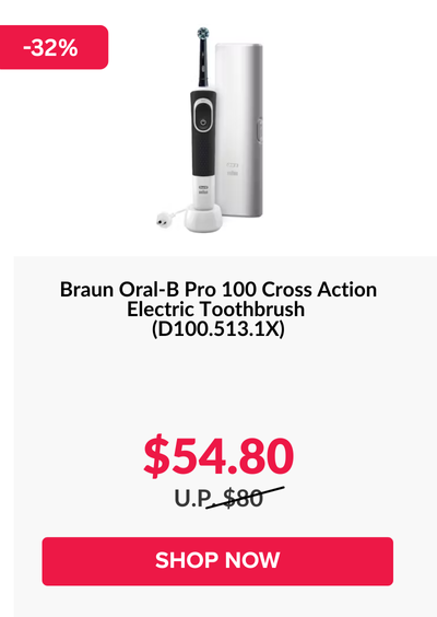 Woman wearing an olive green blazer and light blue jeans walking in an urban setting.