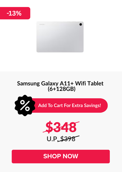 Man in a gray blazer over a dark gray shirt standing on stairs in an urban background.